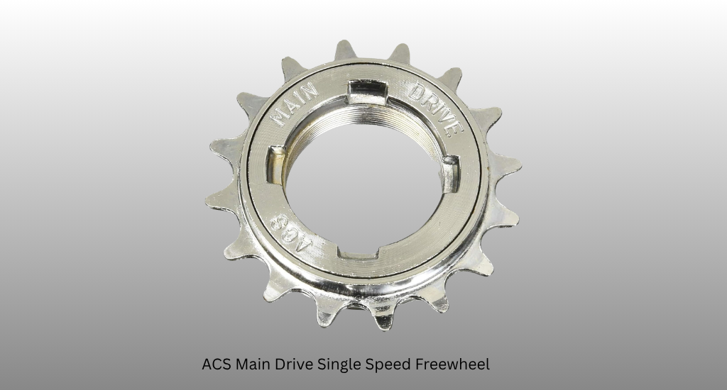 An overhead shot of a chrome ACS Main Drive single-speed freewheel with 14 teeth and a threaded center, displayed against a grey gradient background with a label.